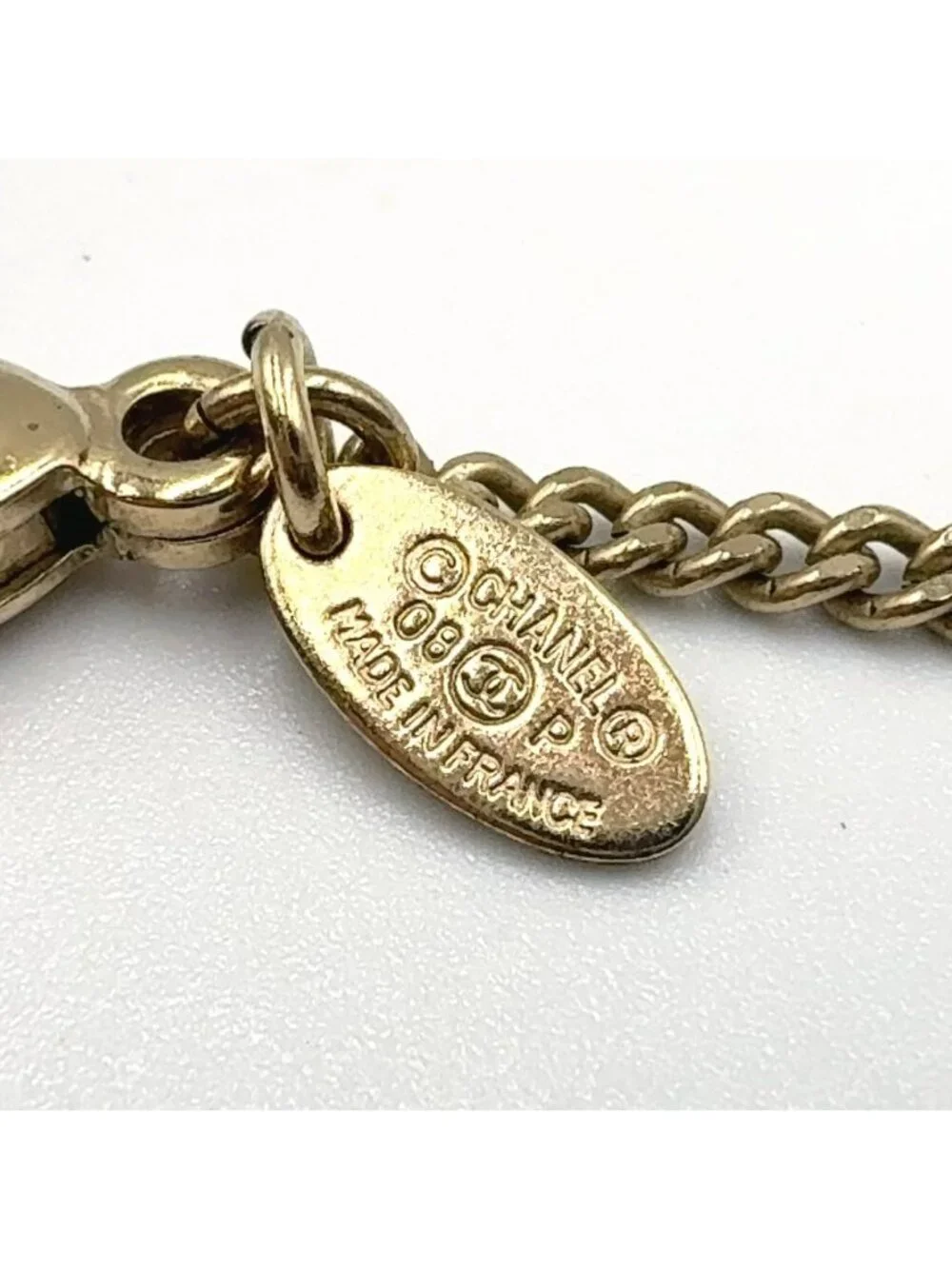 Chanel CC Logo Metiers D'art Rhinestone Clear Gold Light Pink Necklace